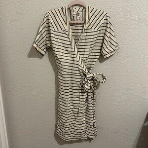 Worn. Good condition but faded coloring. Wrap dress. Size Medium